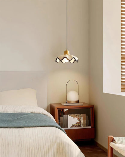 Scalloped pendant light featuring an adjustable height design and wood accent, ideal for dimmable kitchen island lighting. 4
