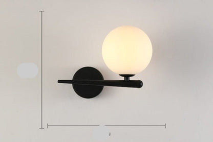 Scandinavian wall lamp featuring a modern minimalist design in gold and black with dimmable LED lighting for adjustable ambiance. 9