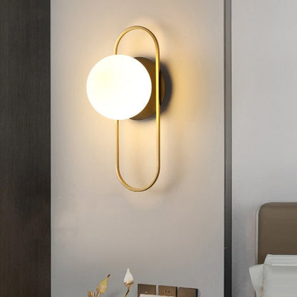 Scandinavian wall lamp featuring a modern minimalist design in gold and black with dimmable LED lighting for adjustable ambiance. 2