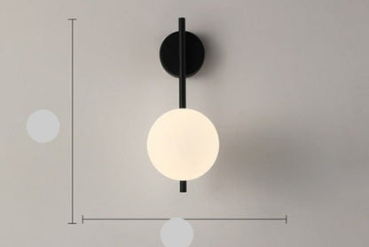 Scandinavian wall lamp featuring a modern minimalist design in gold and black with dimmable LED lighting for adjustable ambiance. 12