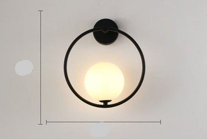 Scandinavian wall lamp featuring a modern minimalist design in gold and black with dimmable LED lighting for adjustable ambiance. 13