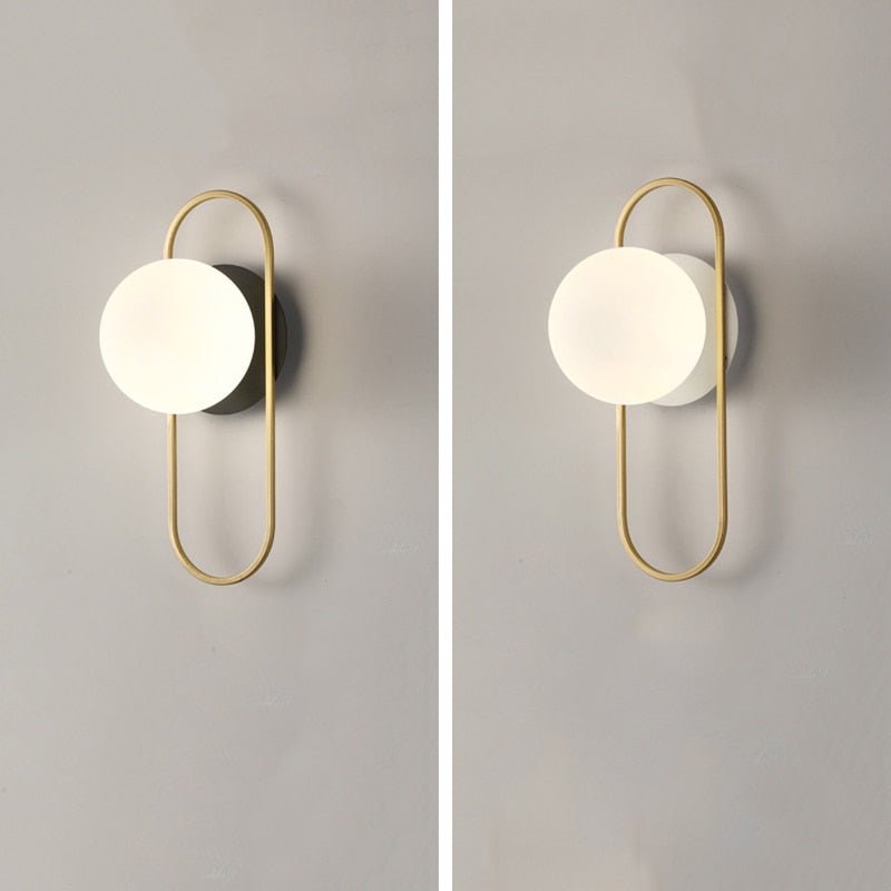 Scandinavian wall lamp featuring a modern minimalist design in gold and black with dimmable LED lighting for adjustable ambiance. 5