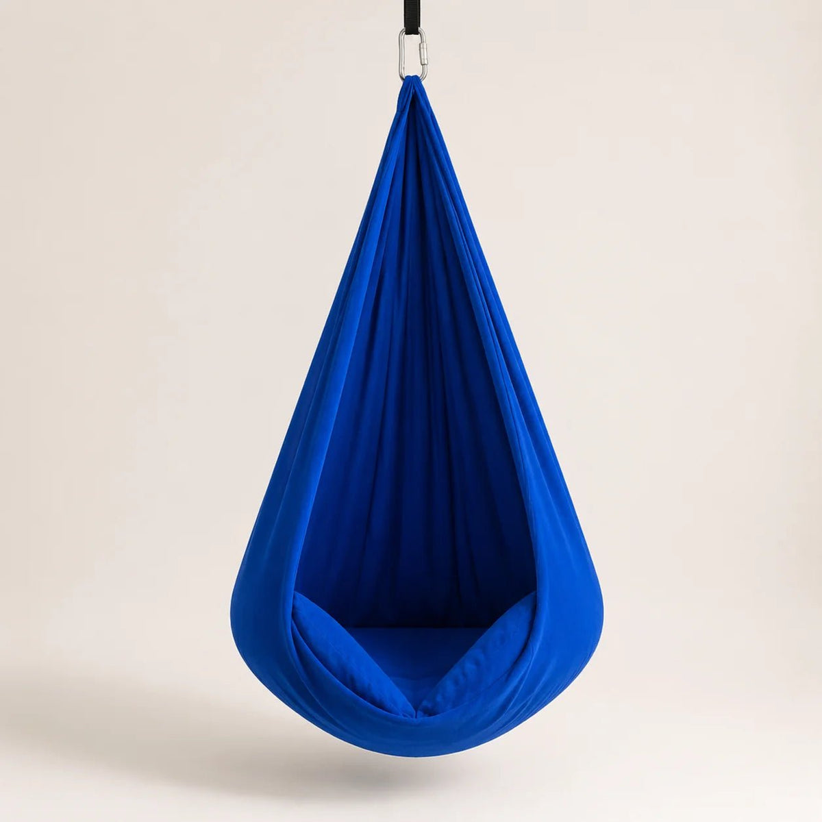Sensory therapy swing designed for indoor relaxation, featuring a durable and comfortable construction that provides a soothing experience for users. 1