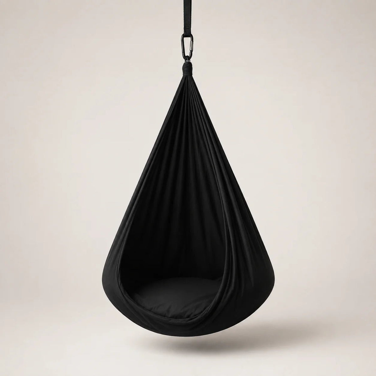 Sensory therapy swing designed for indoor relaxation, featuring a durable and comfortable construction that provides a soothing experience for users. 2