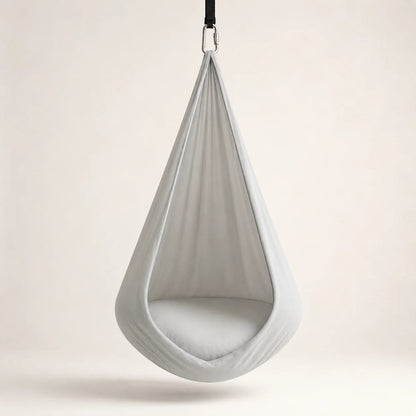 Sensory therapy swing designed for indoor relaxation, featuring a durable and comfortable construction that provides a soothing experience for users. 0