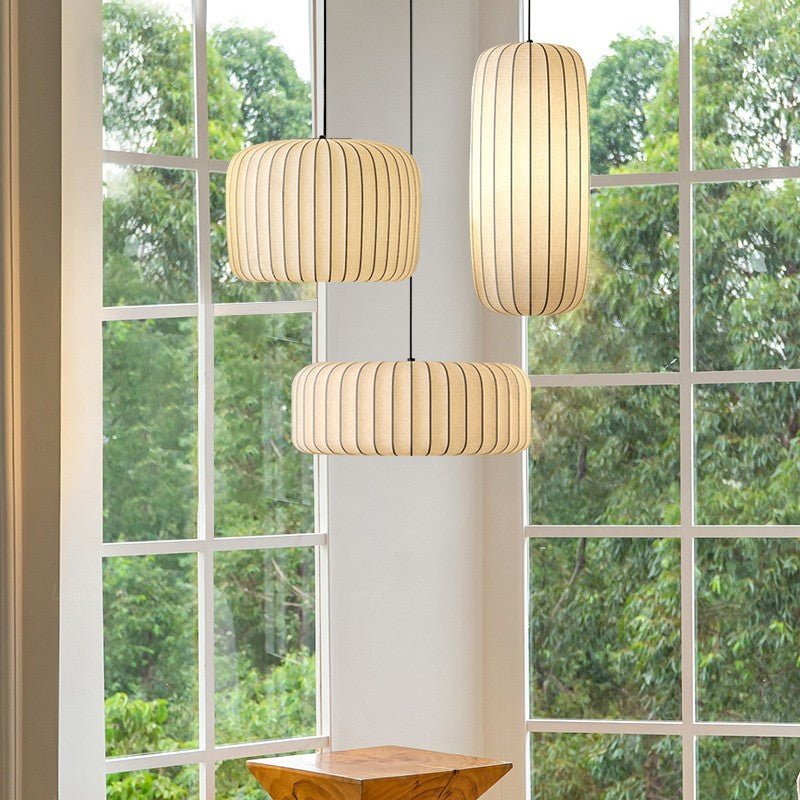 Silk hanging lamp with adjustable height featuring a warm LED glow, designed in a minimalist style for elegant kitchen pendant lighting. 5