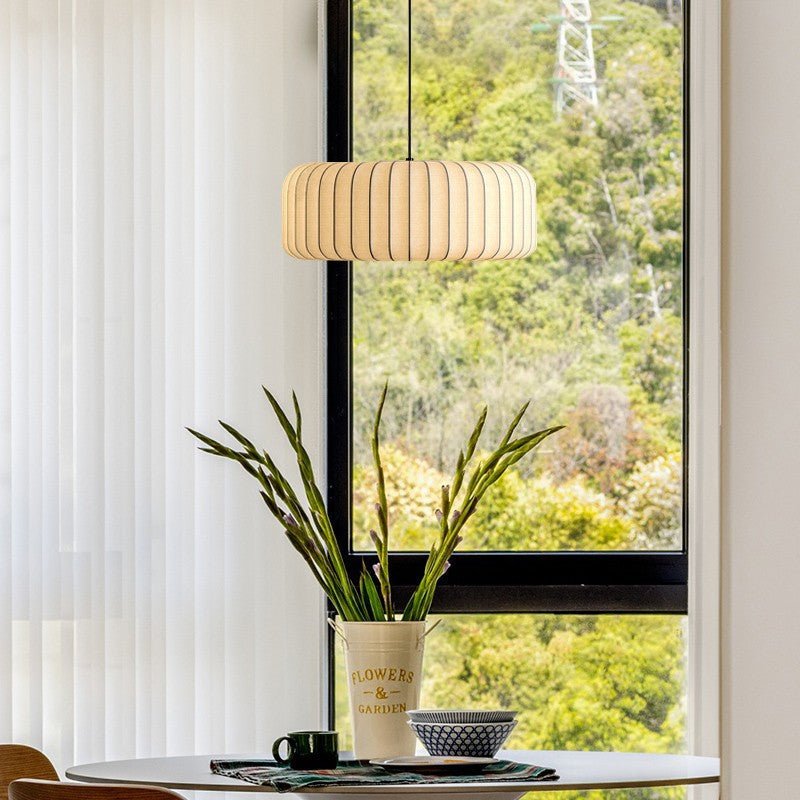 Silk hanging lamp with adjustable height featuring a warm LED glow, designed in a minimalist style for elegant kitchen pendant lighting. 4