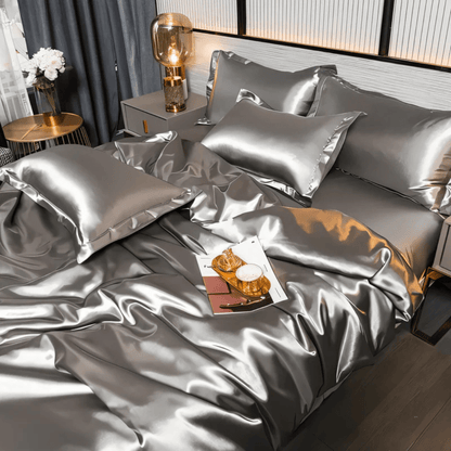 Silk-look bedding set featuring a stylish duvet cover and two matching pillowcases, made from breathable polyester for a luxurious and comfortable sleep experience. 1