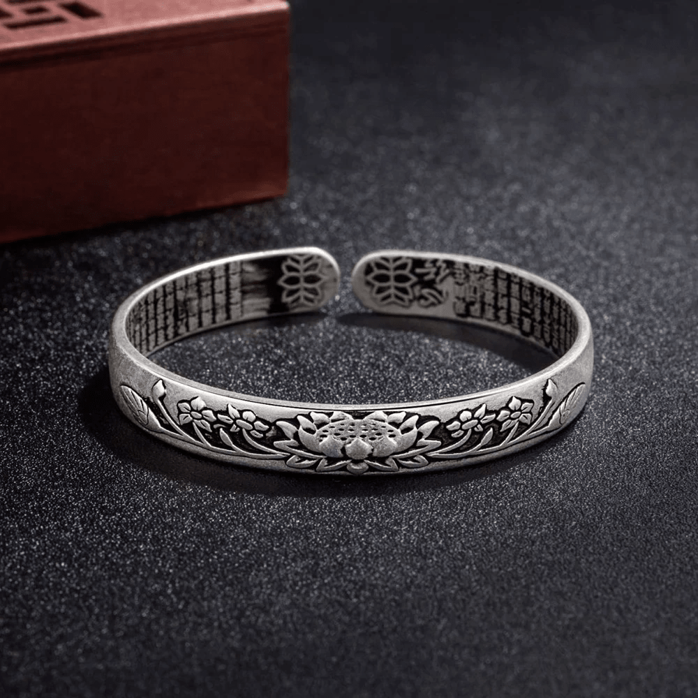 Silver Lotus Bracelet featuring an adjustable design, crafted from hypoallergenic S925 silver, suitable for unisex wear. 1