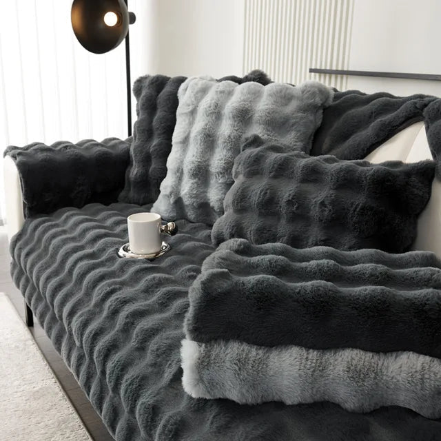 Sofa cover featuring an anti-slip design and pet-resistant material, made from durable washable fabric suitable for all sofa types. 2