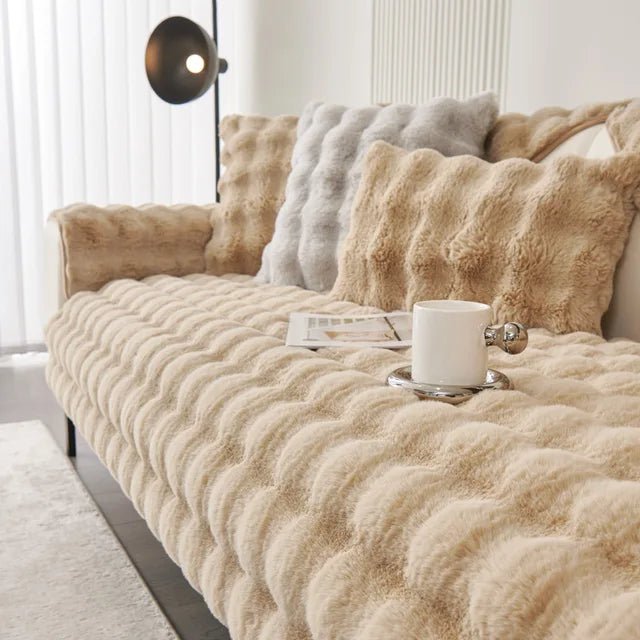 Sofa cover featuring an anti-slip design and pet-resistant material, made from durable washable fabric suitable for all sofa types. 1