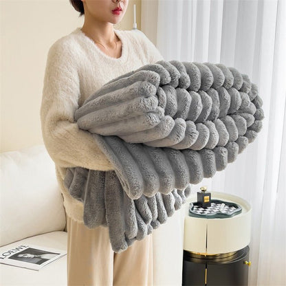 Soft faux fur blanket in a cozy living room setting, showcasing its lightweight design and luxurious texture, perfect for home decor and easy washing. 1