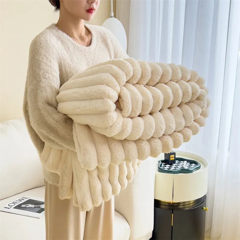 Soft faux fur blanket in a cozy living room setting, showcasing its lightweight design and luxurious texture, perfect for home decor and easy washing. 0