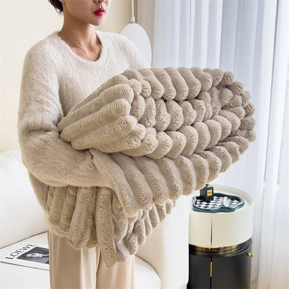 Soft faux fur blanket in a cozy living room setting, showcasing its lightweight design and luxurious texture, perfect for home decor and easy washing. 3