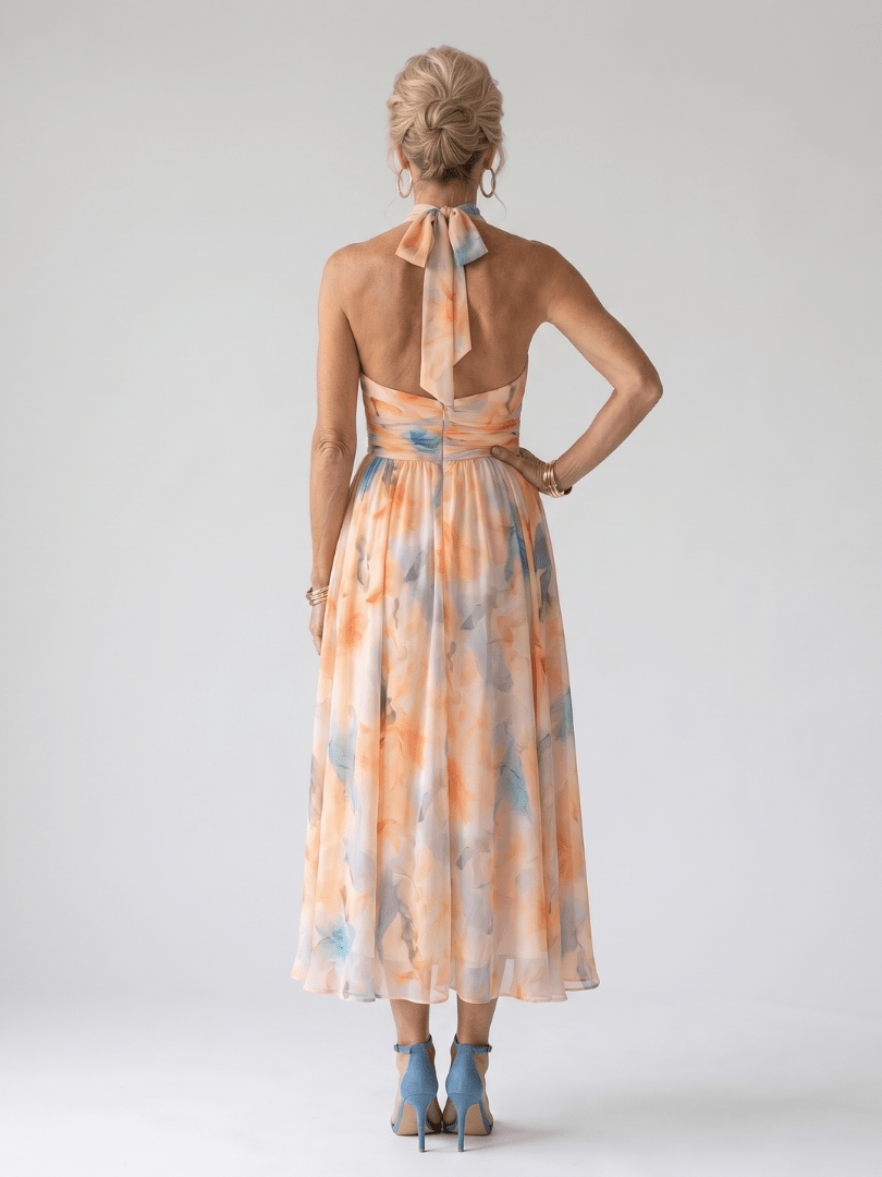 Soft halter midi dress with gathered bodice in lightweight white fabric, perfect for summer wear for women. 2
