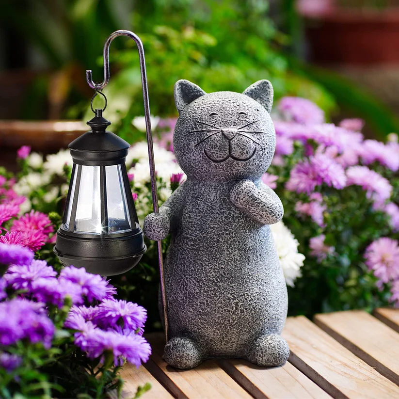 Hand-painted solar garden cat statue featuring a butterfly light, perfect for adding charm and illumination to your outdoor space. 1