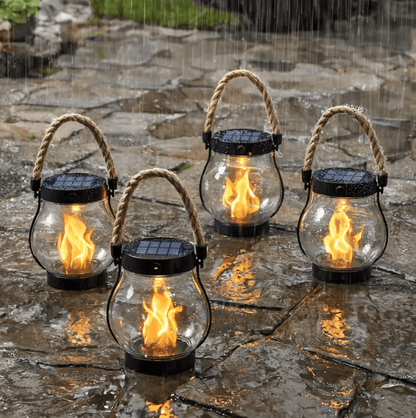 Solar garden light featuring a realistic flame effect, designed for outdoor use with automatic dusk activation and a weatherproof construction. 1