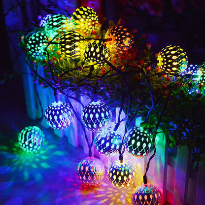 Solar garden lights garland featuring LED spherical lanterns in a Moroccan style, ideal for outdoor decoration, showcasing intricate metal designs that enhance your garden ambiance. 9