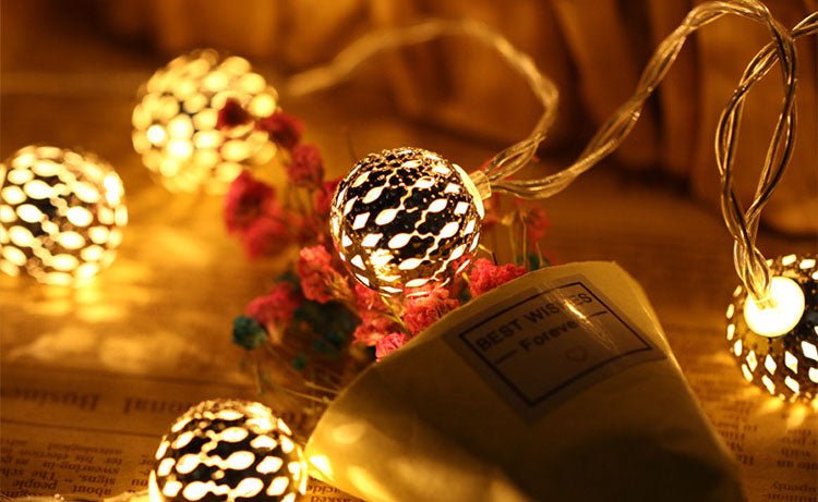 Solar garden lights garland featuring LED spherical lanterns in a Moroccan style, ideal for outdoor decoration, showcasing intricate metal designs that enhance your garden ambiance. 4