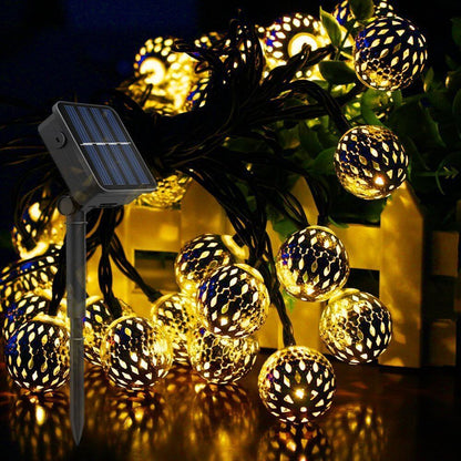 Solar garden lights garland featuring LED spherical lanterns in a Moroccan style, ideal for outdoor decoration, showcasing intricate metal designs that enhance your garden ambiance. 2