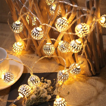Solar garden lights garland featuring LED spherical lanterns in a Moroccan style, ideal for outdoor decoration, showcasing intricate metal designs that enhance your garden ambiance. 1