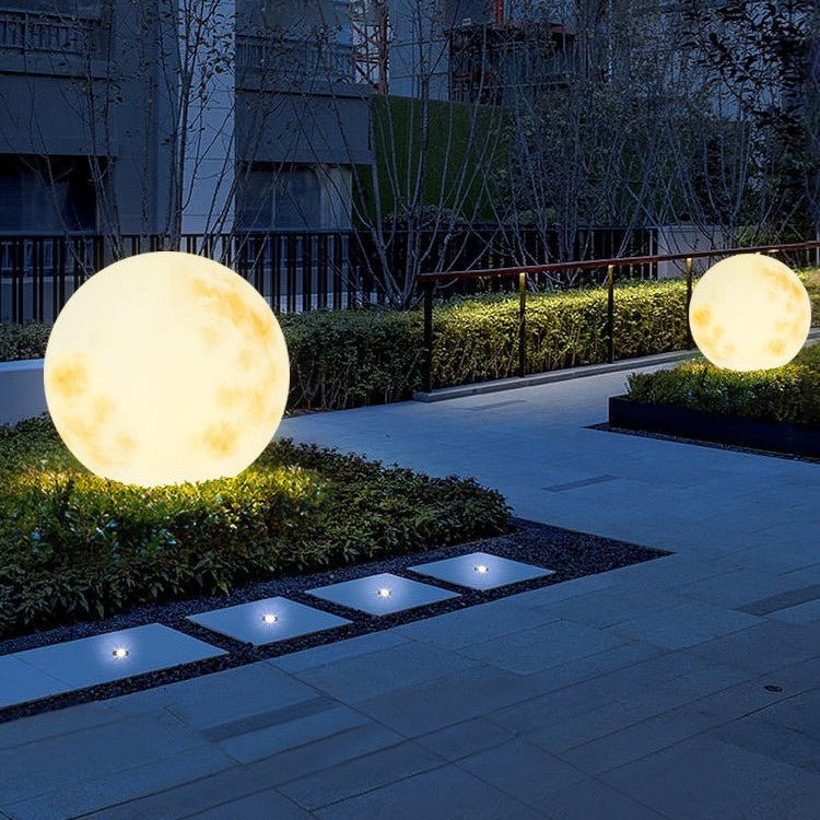 Solar garden lights featuring a unique LED moon design, perfect for eco-friendly outdoor lighting in paths and gardens. 3