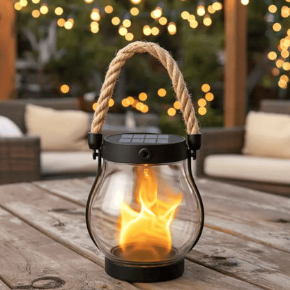 Solar hanging lantern with flame effect, designed for outdoor use, waterproof construction, perfect for enhancing garden ambiance at night. 0