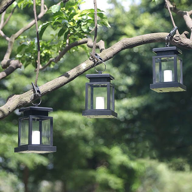 Solar hanging lantern featuring a realistic LED candle effect, perfect for adding a classic touch to outdoor spaces while providing eco-friendly illumination. 2