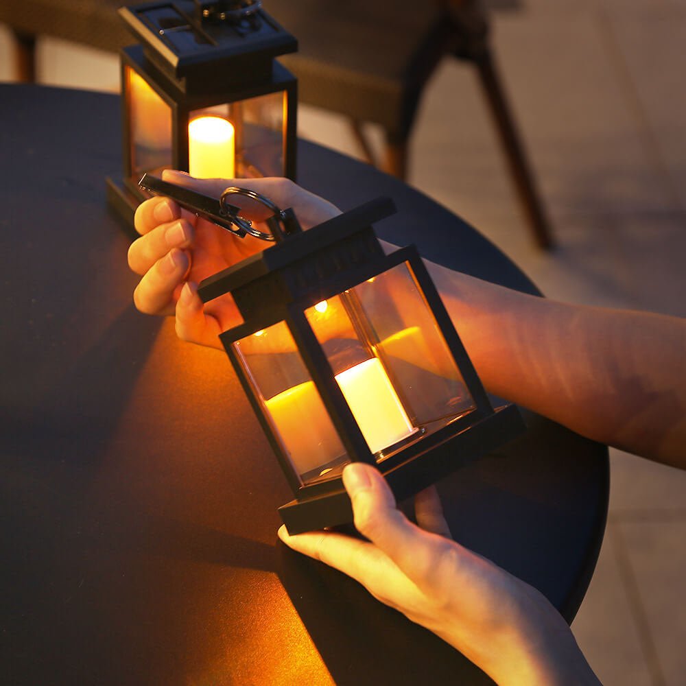 Solar hanging lantern featuring a realistic LED candle effect, perfect for adding a classic touch to outdoor spaces while providing eco-friendly illumination. 4