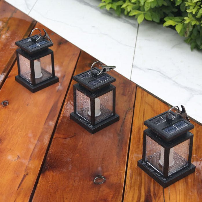 Solar hanging lantern featuring a realistic LED candle effect, perfect for adding a classic touch to outdoor spaces while providing eco-friendly illumination. 7