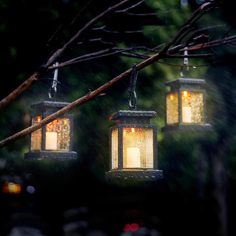 Solar hanging lantern featuring a realistic LED candle effect, perfect for adding a classic touch to outdoor spaces while providing eco-friendly illumination. 5