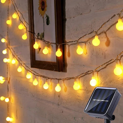 Solar LED string lights with automatic sensor, 10m length, waterproof design for outdoor garden decor, featuring warm white fairy lights ideal for creating a magical 5