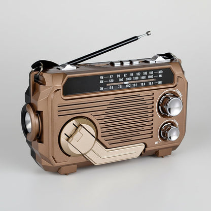 Solar-powered emergency radio with hand crank and Bluetooth, featuring a compact design and built-in flashlight for multi-function use during emergencies and outdoor activities. 0