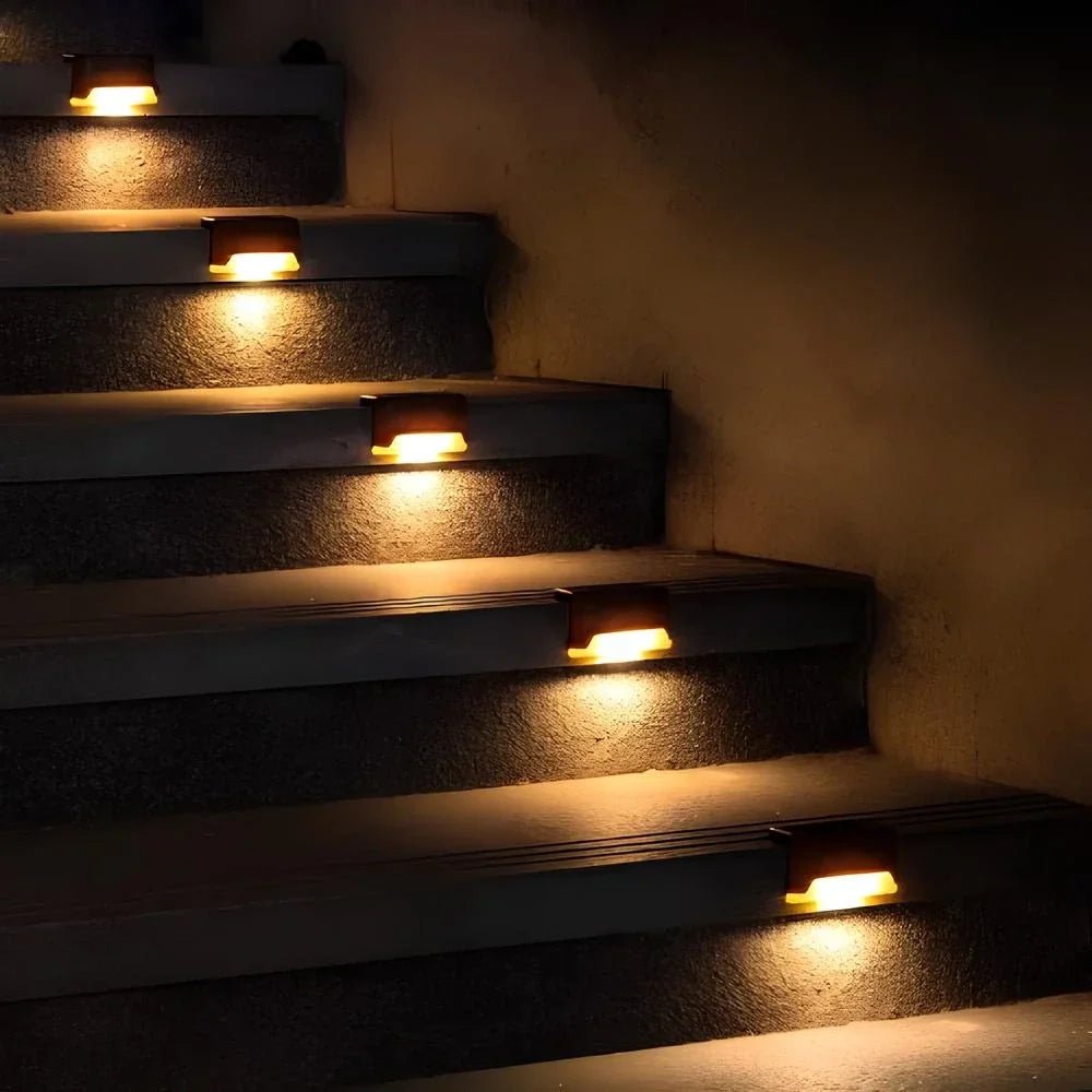 Solar step lights for outdoor use, featuring a compact design in brown or black housing, sold in an 8 pack, ideal for illuminating pathways and enhancing 5
