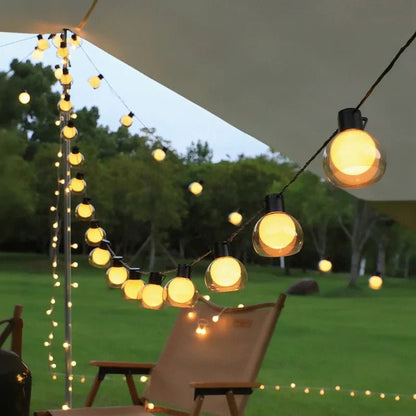 Solar string lights featuring warm white twinkle bulbs, perfect for outdoor decorative lighting in 16.4ft and 32.8ft lengths. 4