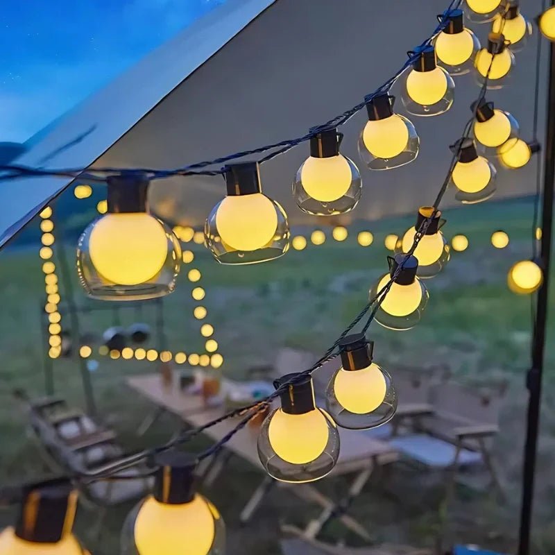Solar string lights featuring warm white twinkle bulbs, perfect for outdoor decorative lighting in 16.4ft and 32.8ft lengths. 6