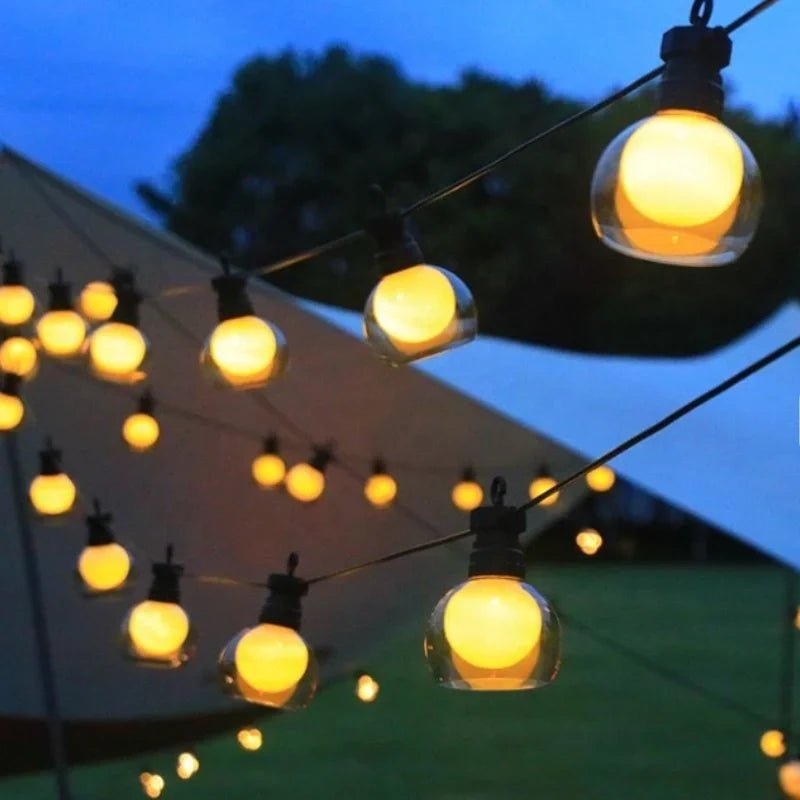 Solar string lights featuring warm white twinkle bulbs, perfect for outdoor decorative lighting in 16.4ft and 32.8ft lengths. 3