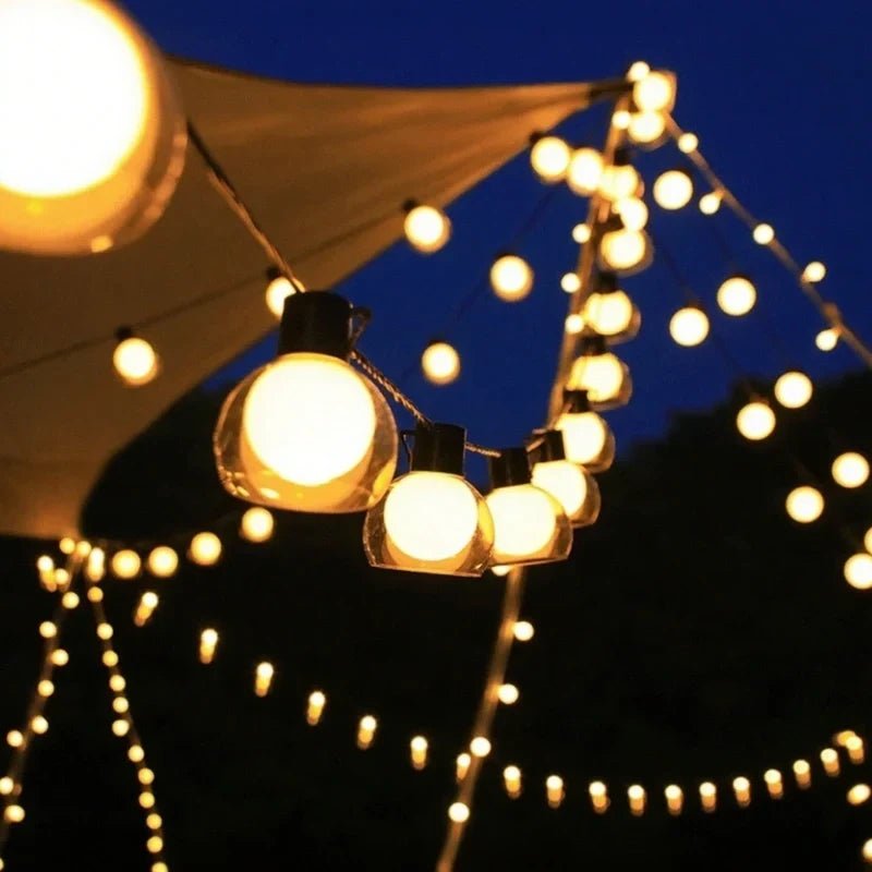 Solar string lights featuring warm white twinkle bulbs, perfect for outdoor decorative lighting in 16.4ft and 32.8ft lengths. 1