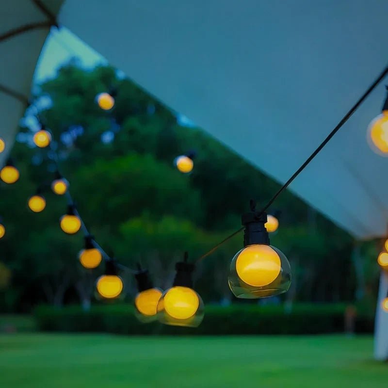Solar string lights featuring warm white twinkle bulbs, perfect for outdoor decorative lighting in 16.4ft and 32.8ft lengths. 5