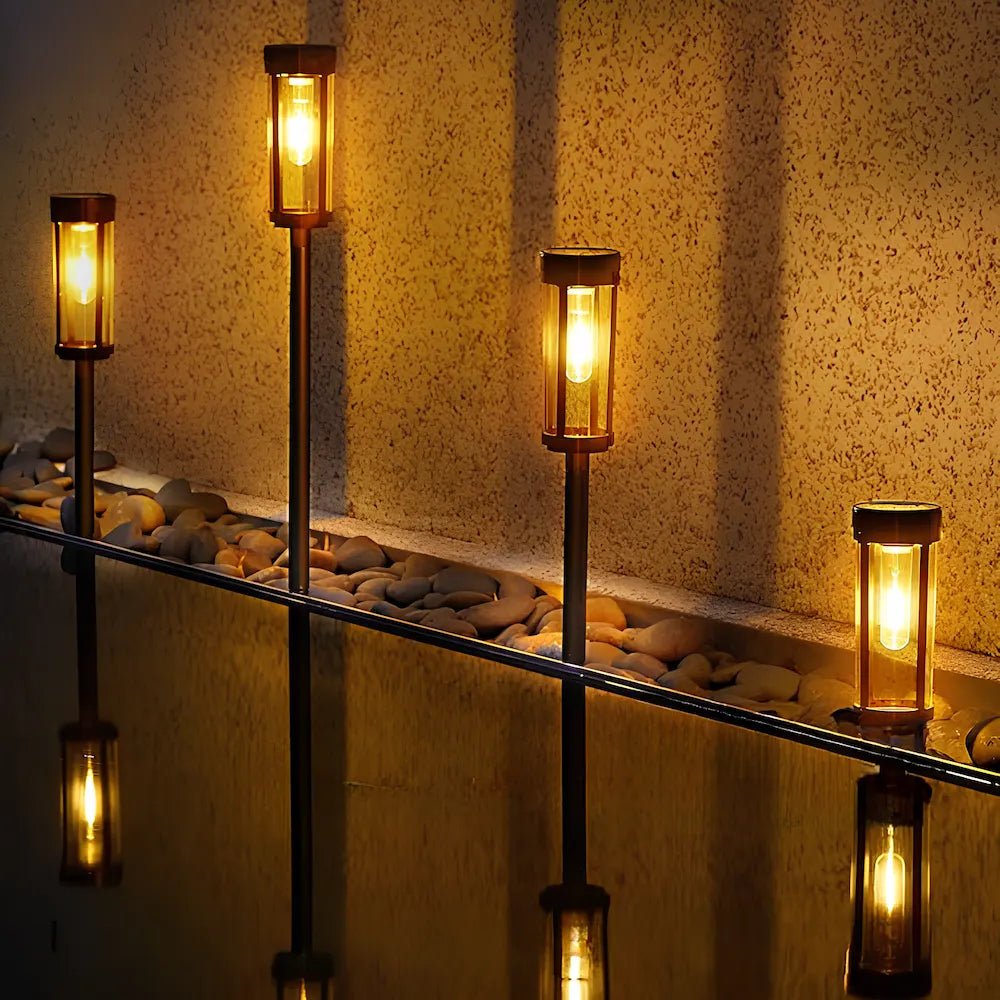 Solar torch lights outdoor with flickering flame effect, designed for garden and yard pathways, featuring a sleek black finish for stylish outdoor lighting. 0