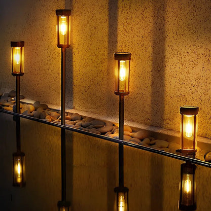 Solar torch lights outdoor with flickering flame effect, designed for garden and yard pathways, featuring a sleek black finish for stylish outdoor lighting. 0