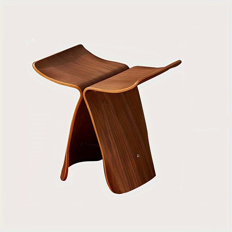 Solid wood butterfly stool with a natural finish, featuring a timeless design for compact and versatile seating in any space. 3