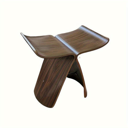 Solid wood butterfly stool with a natural finish, featuring a timeless design for compact and versatile seating in any space. 8
