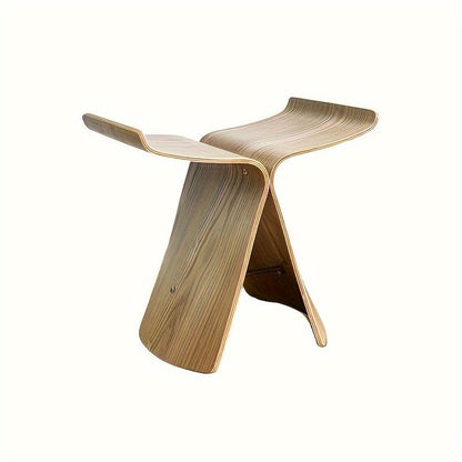 Solid wood butterfly stool with a natural finish, featuring a timeless design for compact and versatile seating in any space. 0