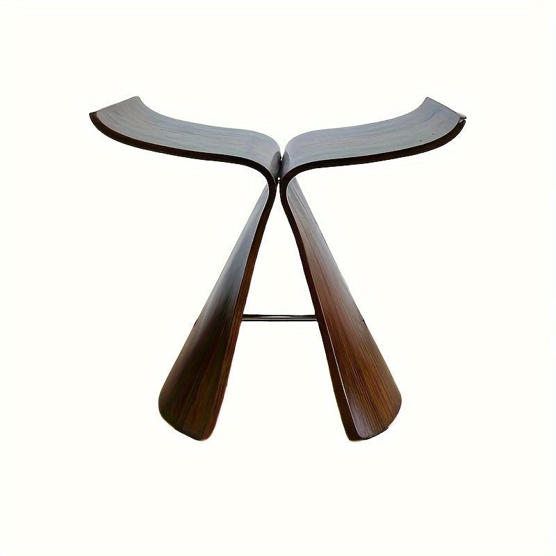 Solid wood butterfly stool with a natural finish, featuring a timeless design for compact and versatile seating in any space. 2