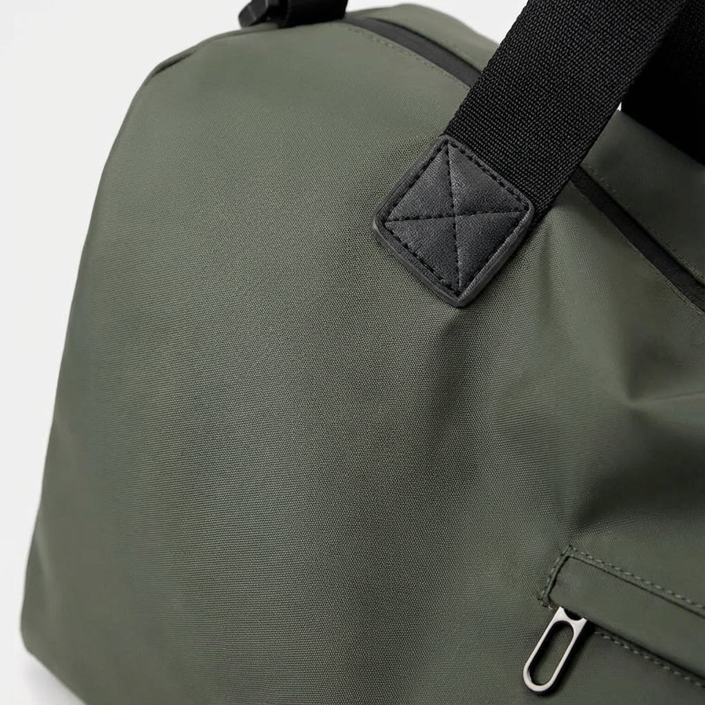 Spacious waterproof travel bag with adjustable strap, made from durable fabric, perfect for weekend getaways.

 3