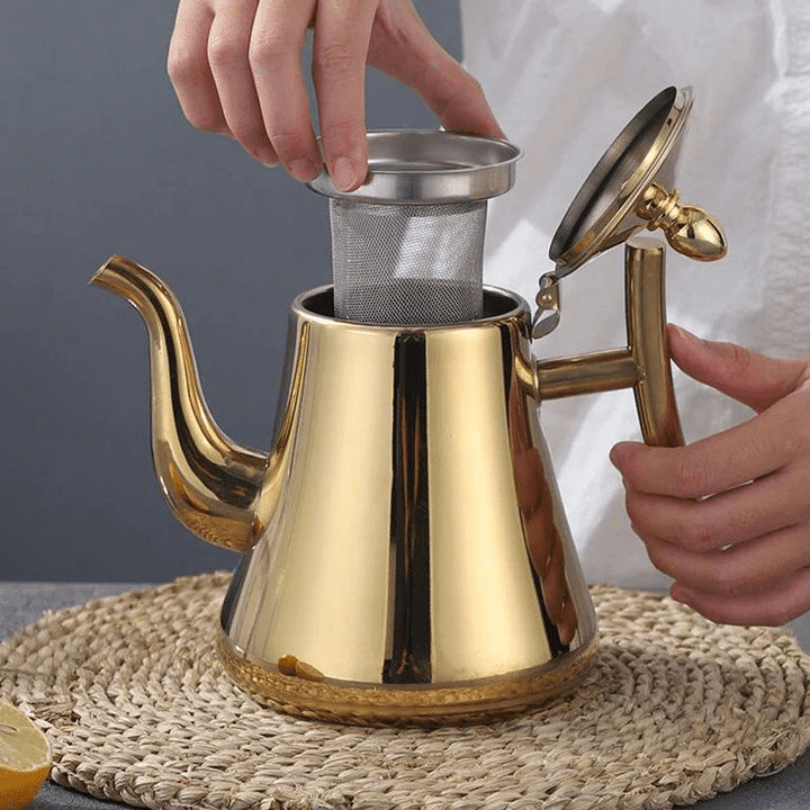Stainless steel electric kettle with built-in filter and modern induction design, perfect for fast heating and brewing tea or coffee. 2