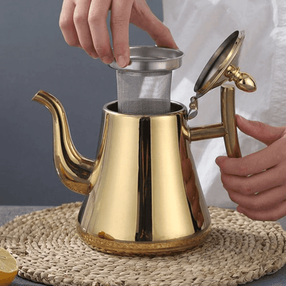 Stainless steel electric kettle with built-in filter and modern induction design, perfect for fast heating and brewing tea or coffee. 2