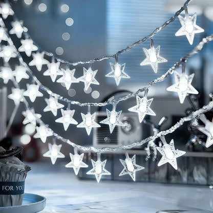 Multi-color LED star fairy string lights powered by batteries, perfect for adding a whimsical touch to any indoor or outdoor space. 1