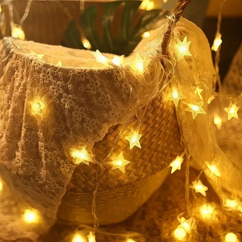 Multi-color LED star fairy string lights powered by batteries, perfect for adding a whimsical touch to any indoor or outdoor space. 2